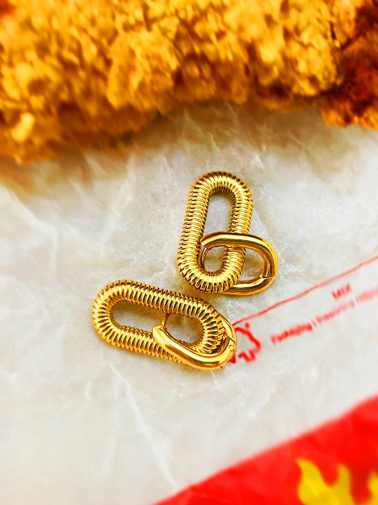 Fairies Whisper Arena Earrings styled with fried chicken, bold gold industrial spring design jewelry photo