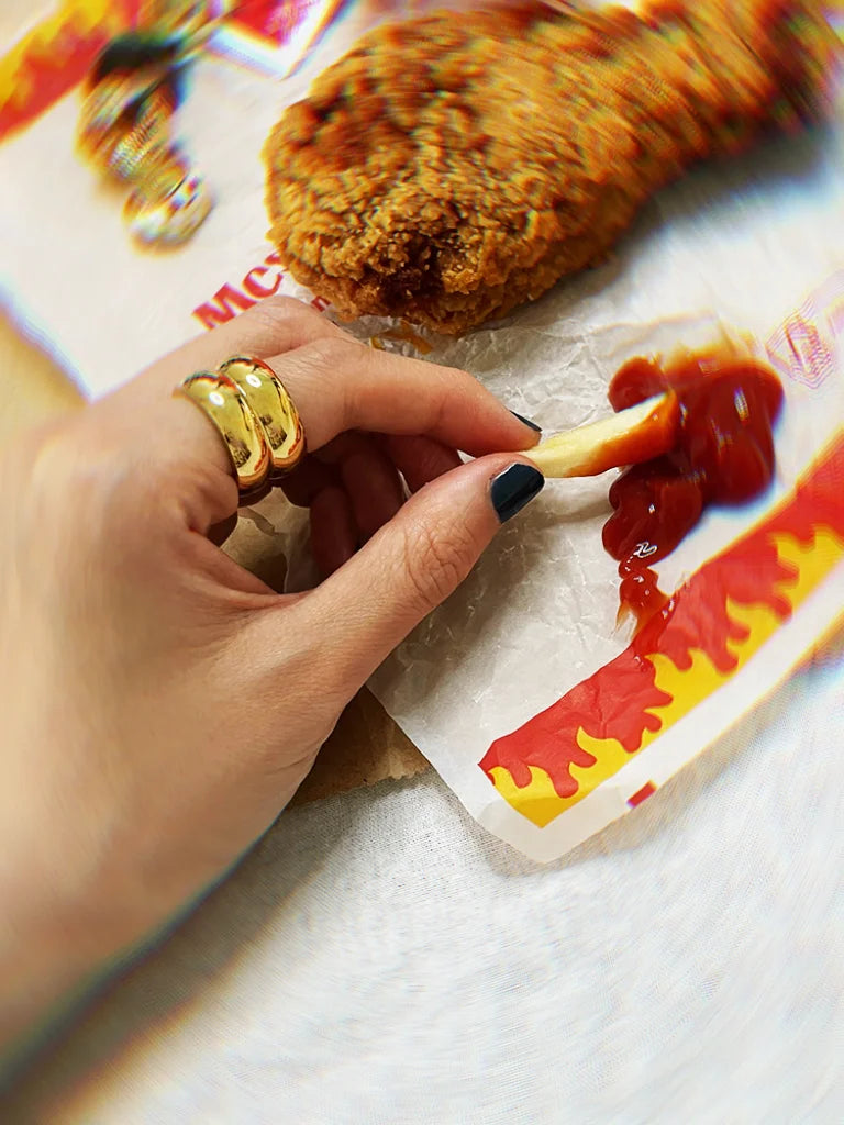 Fairies Whisper Statue of Liberty Ring close-up, glossy gold statement jewelry with heavy luxury style