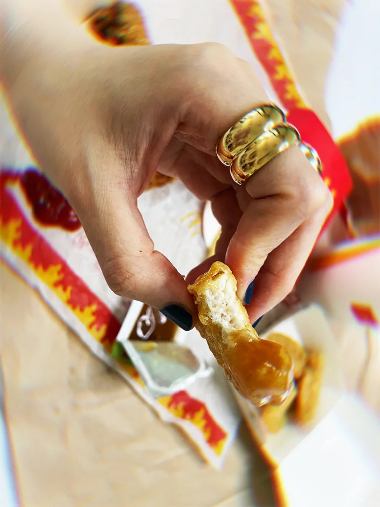 Fairies Whisper Statue of Liberty Ring styled on fast food wrapper, ironic bold gold jewelry design