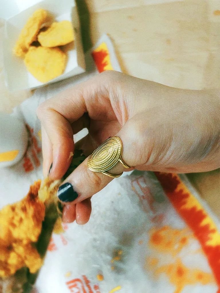 Fairies Whisper Gold relic series, Friday Shield Ring styled with fast food scene, dramatic warrior confidence jewelry photo