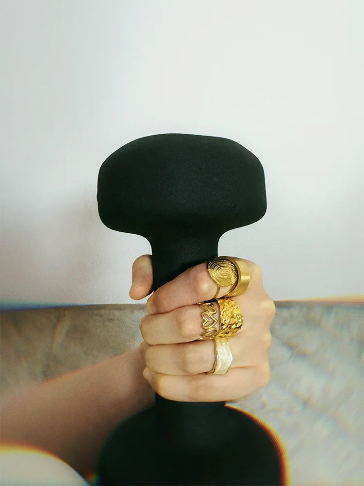 Fairies Whisper Venus de Milo Ring front view, wide gold ring wrapping around finger with textured broken imperfect design