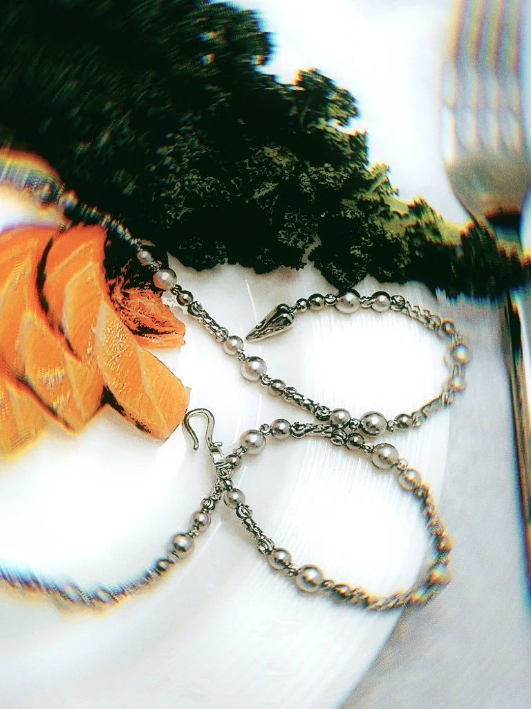 Silver long necklace “Seaweed,” combining pearl-like matte beads with glossy metallic details, Chanel-inspired.