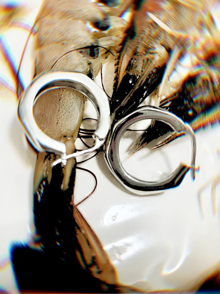 Fairies Whisper Fish Market series silver wave bubble polygon earrings, medium small hoops displayed for scale.