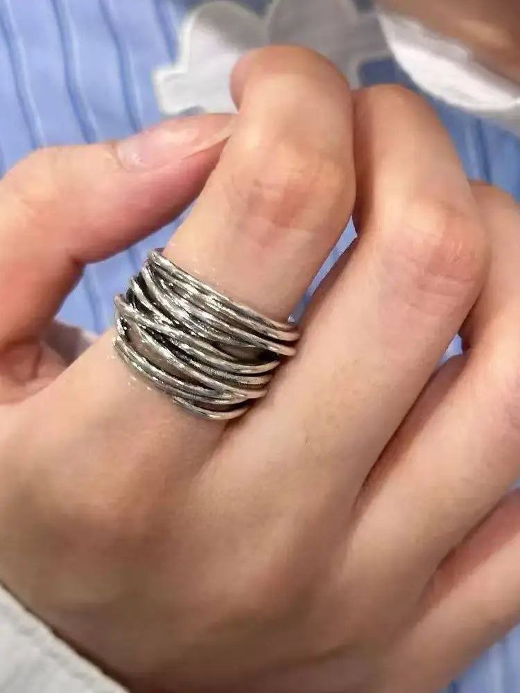 Cross-wrapped vintage multi-layer ring distressed with braided line openings