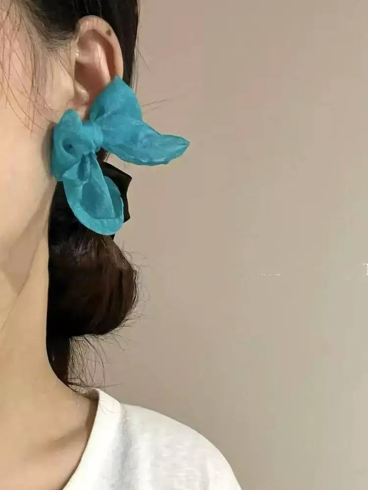 Braided yarn with blue bow earrings
