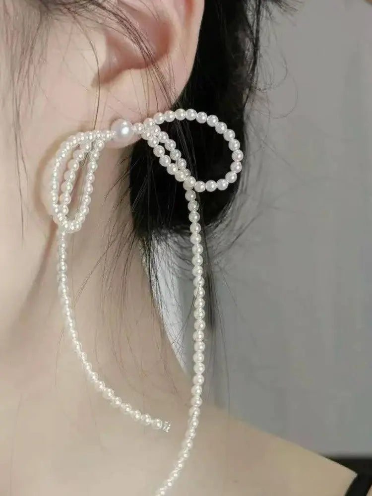 petites boucles d'oreilles en tresse de perles et gros nœud