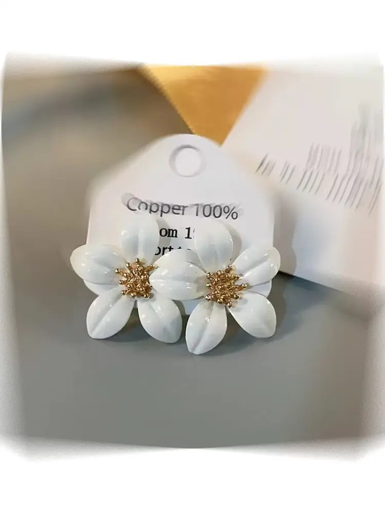 Boucles d'oreilles SS26 à motif floral émaillé, finition métallisée