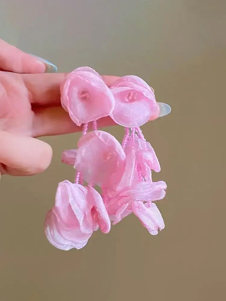 Boucles d'oreilles à clip en gaze tissée, motif étamines vibrantes