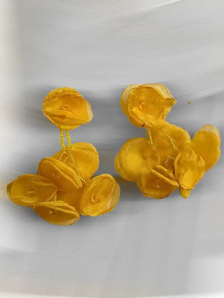 Boucles d'oreilles à clip en gaze tissée, motif étamines vibrantes