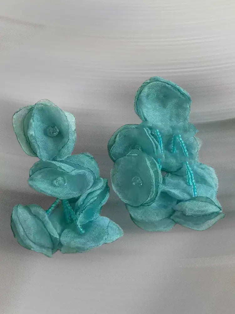 Boucles d'oreilles à clip en gaze tissée, motif étamines vibrantes