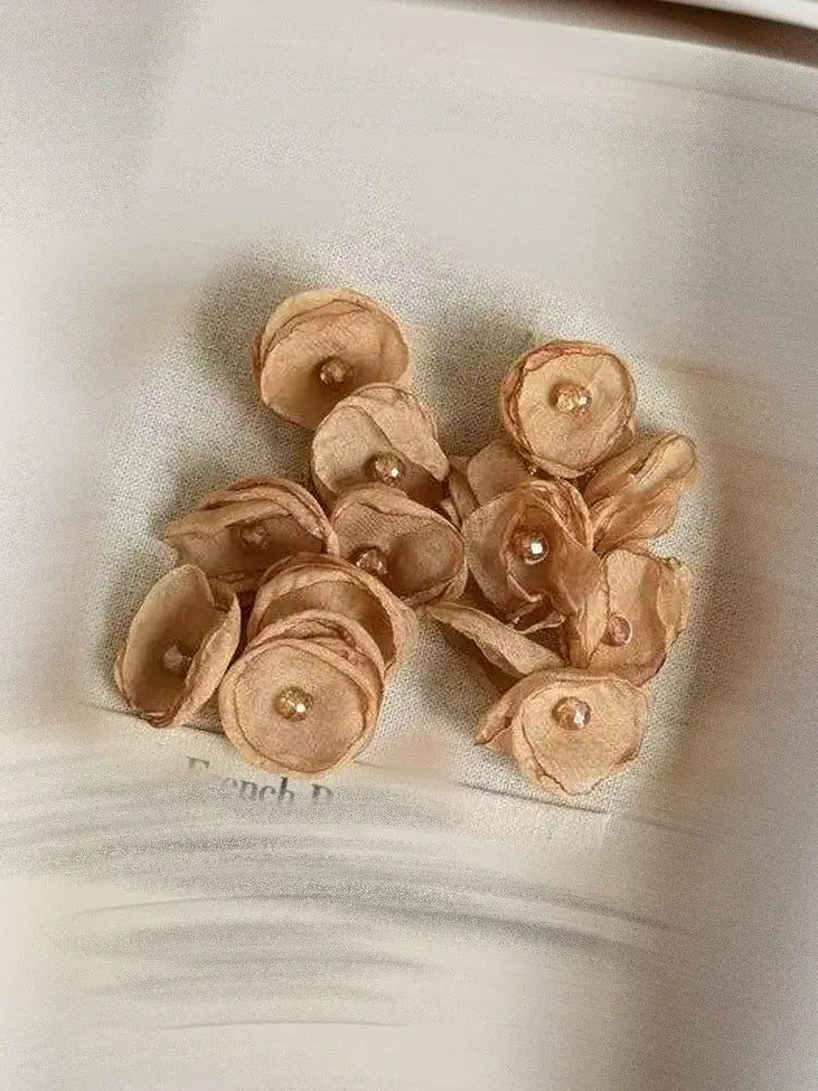 Boucles d'oreilles à clip en gaze tissée, motif étamines vibrantes