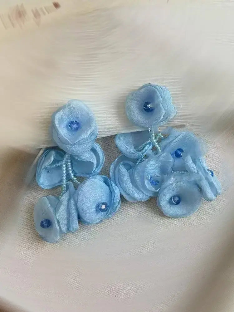 Boucles d'oreilles à clip en gaze tissée, motif étamines vibrantes