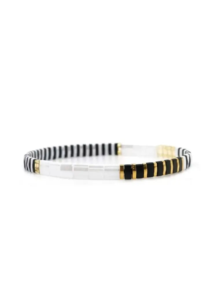 Bracelet manchette en or noir et or avec pierres précieuses bicolores