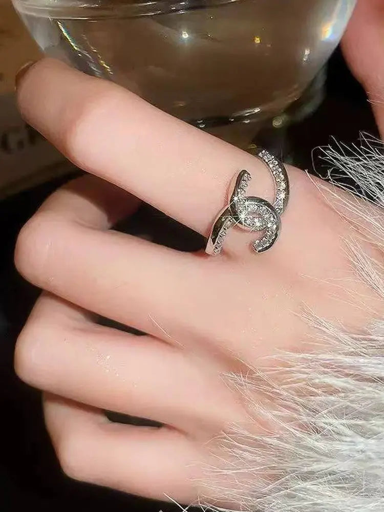 Ring interlocking cross open ring luxe