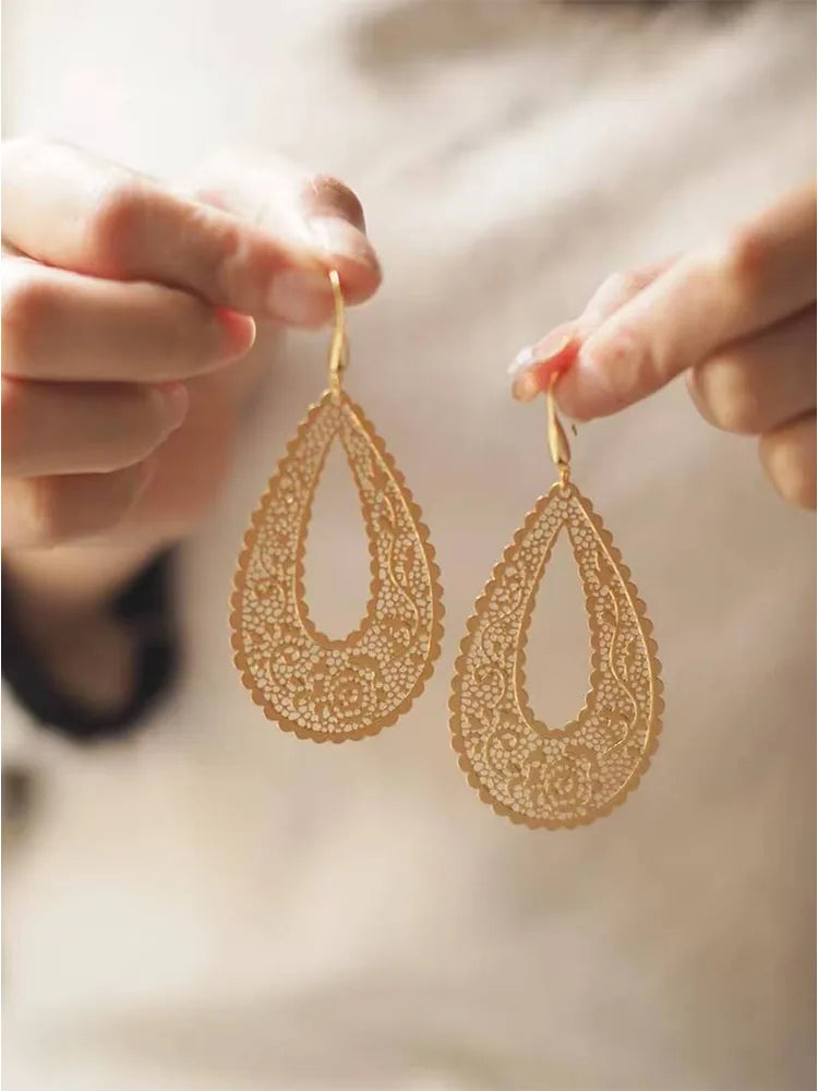 Gold hollow statement earrings