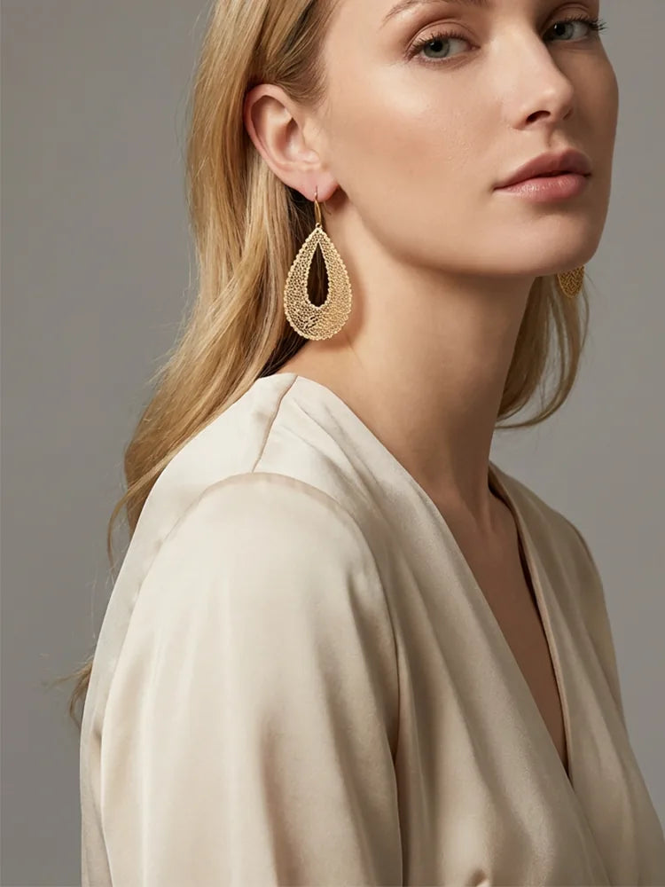 Gold hollow statement earrings