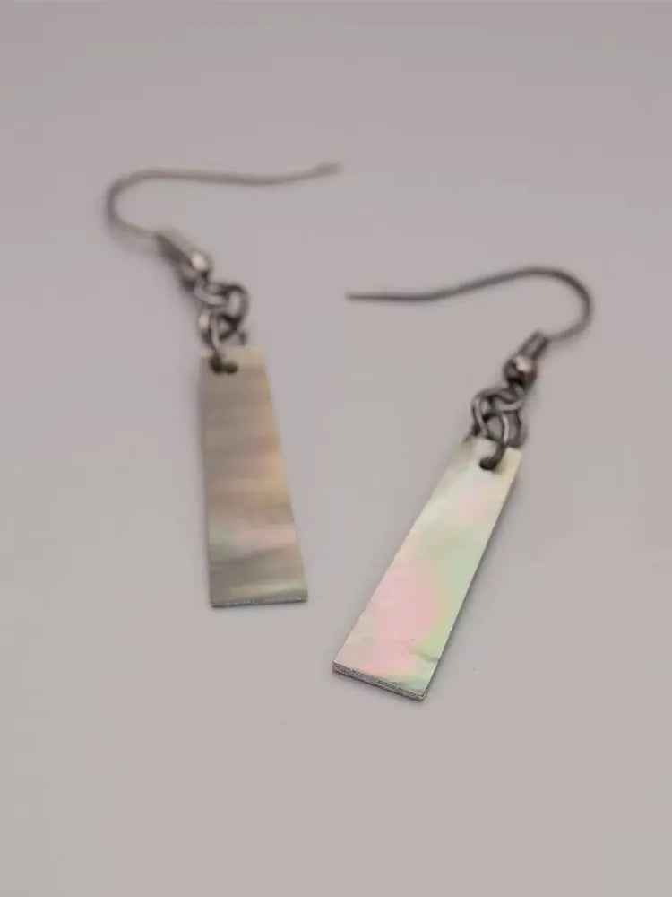 Minimalist shell earrings with a mica-like finish