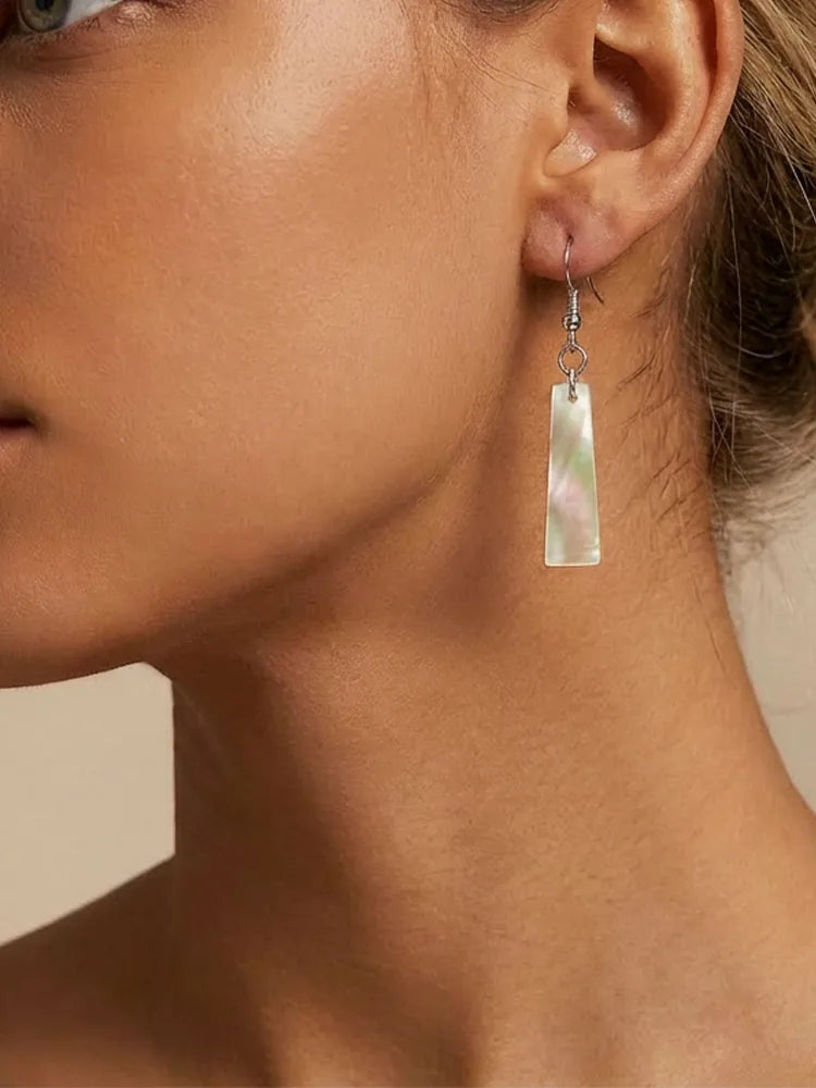 Minimalist shell earrings with a mica-like finish