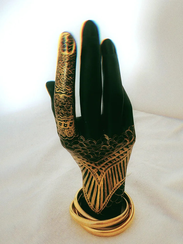 Fairies Whisper The Feast Collection Statue of Liberty Bracelet, gold coiled metal spring-inspired jewelry