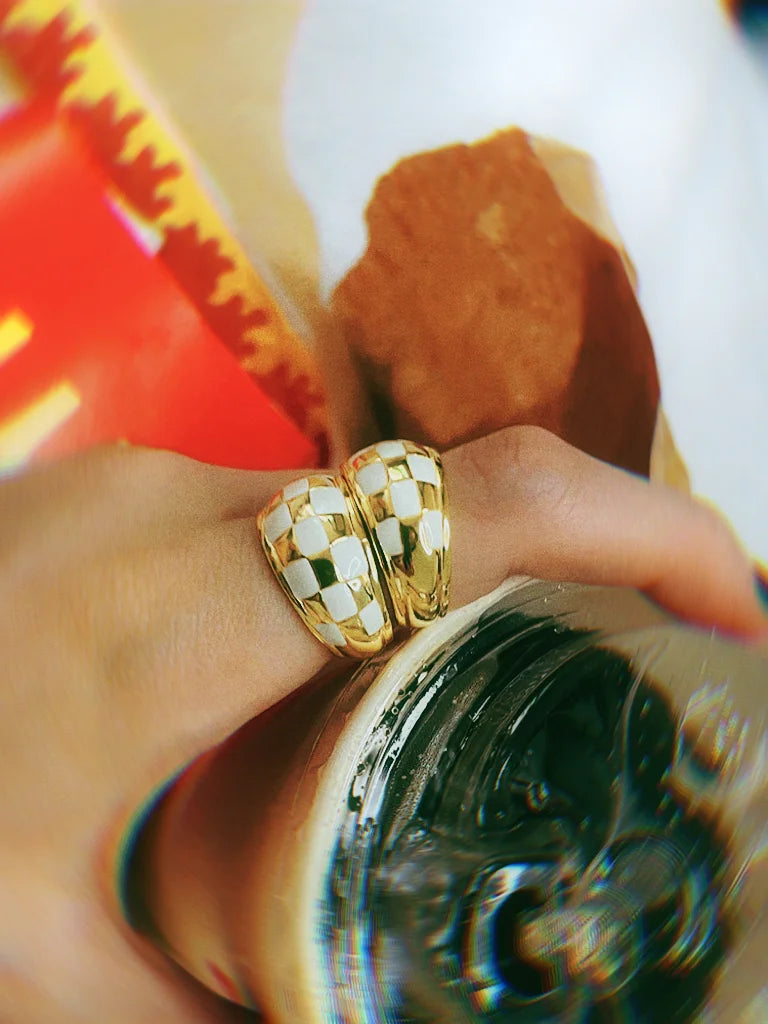 Fairies Whisper Shakespeare ring close-up detail, gold and white checkerboard texture jewelry