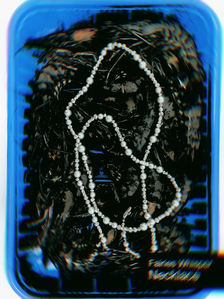 Seaweed necklace, silver long chain with frosted pearl-effect beads and shiny metallic spheres, layered style.