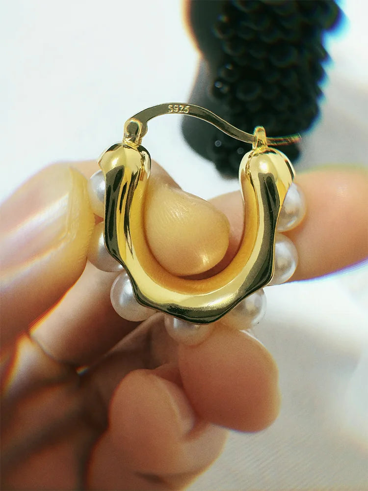 Fairies Whisper Pearl 404 Earrings worn on ear, minimalist gold and pearl jewelry design