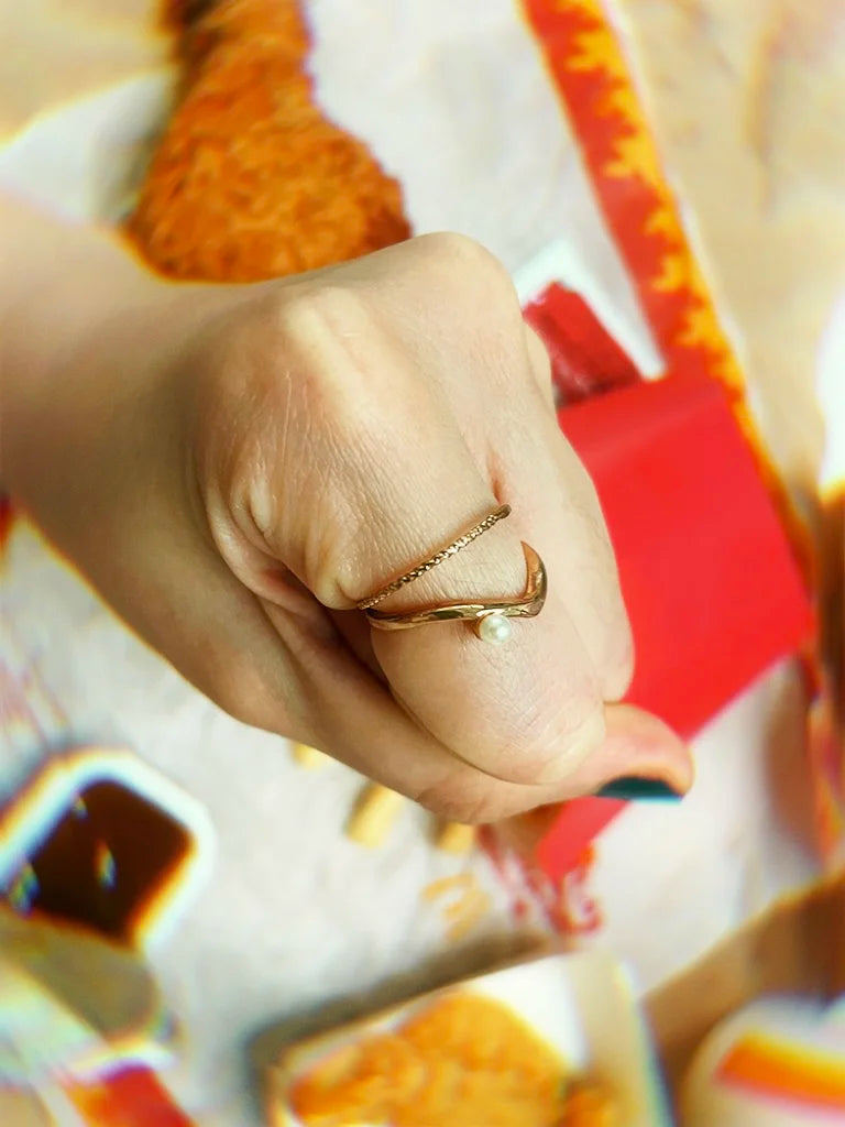 Fairies Whisper slim pearl gold ring stacked with thin band rings, stylish layered jewelry