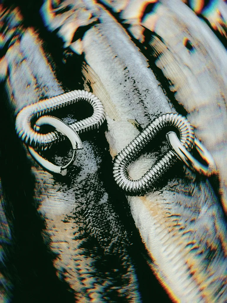 Fairies Whisper silver Arena earrings, rounded rectangular hoops with spiral texture, inspired by Roman colosseum.