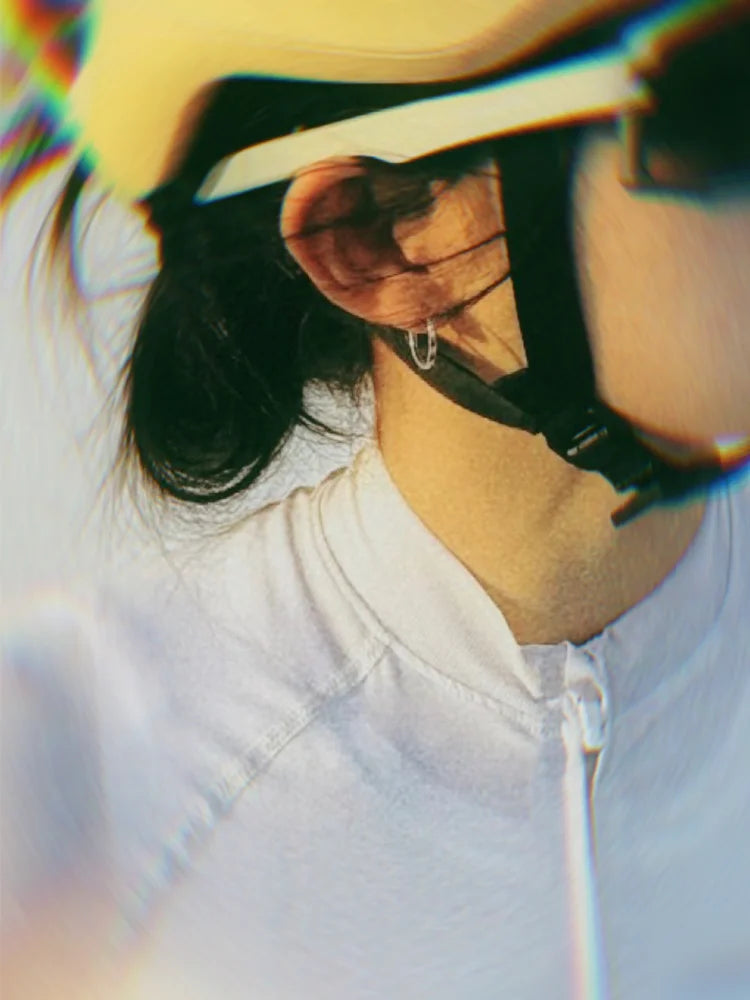 Fairies Whisper Fish Market Silver Athlete wearing silver Fish Eye earrings, highlighting sporty and dynamic style.