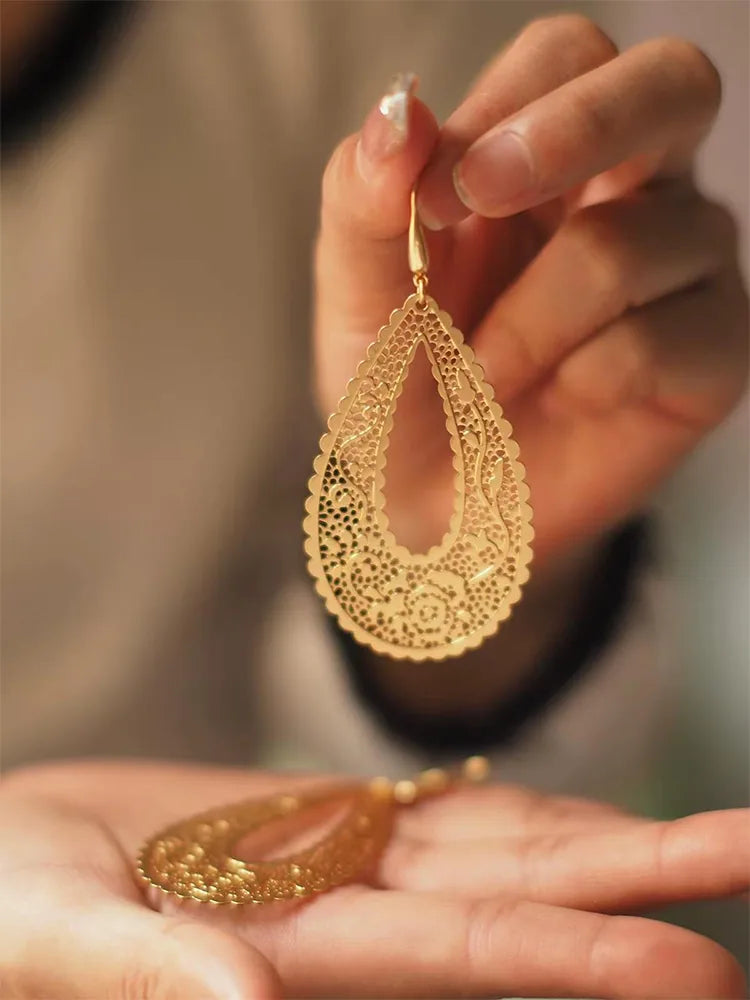 Gold hollow statement earrings Lifestyle Photo — Dainty Jewelry